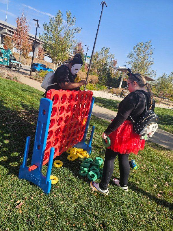 APM participants playing a giant game in the park