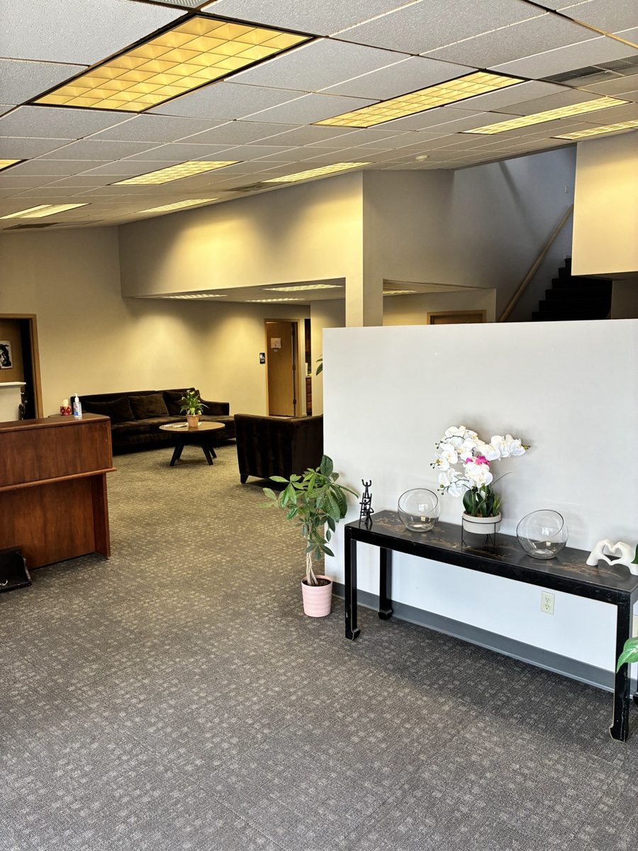Front lobby with couches and plants at the B.A.S.I.C. campus