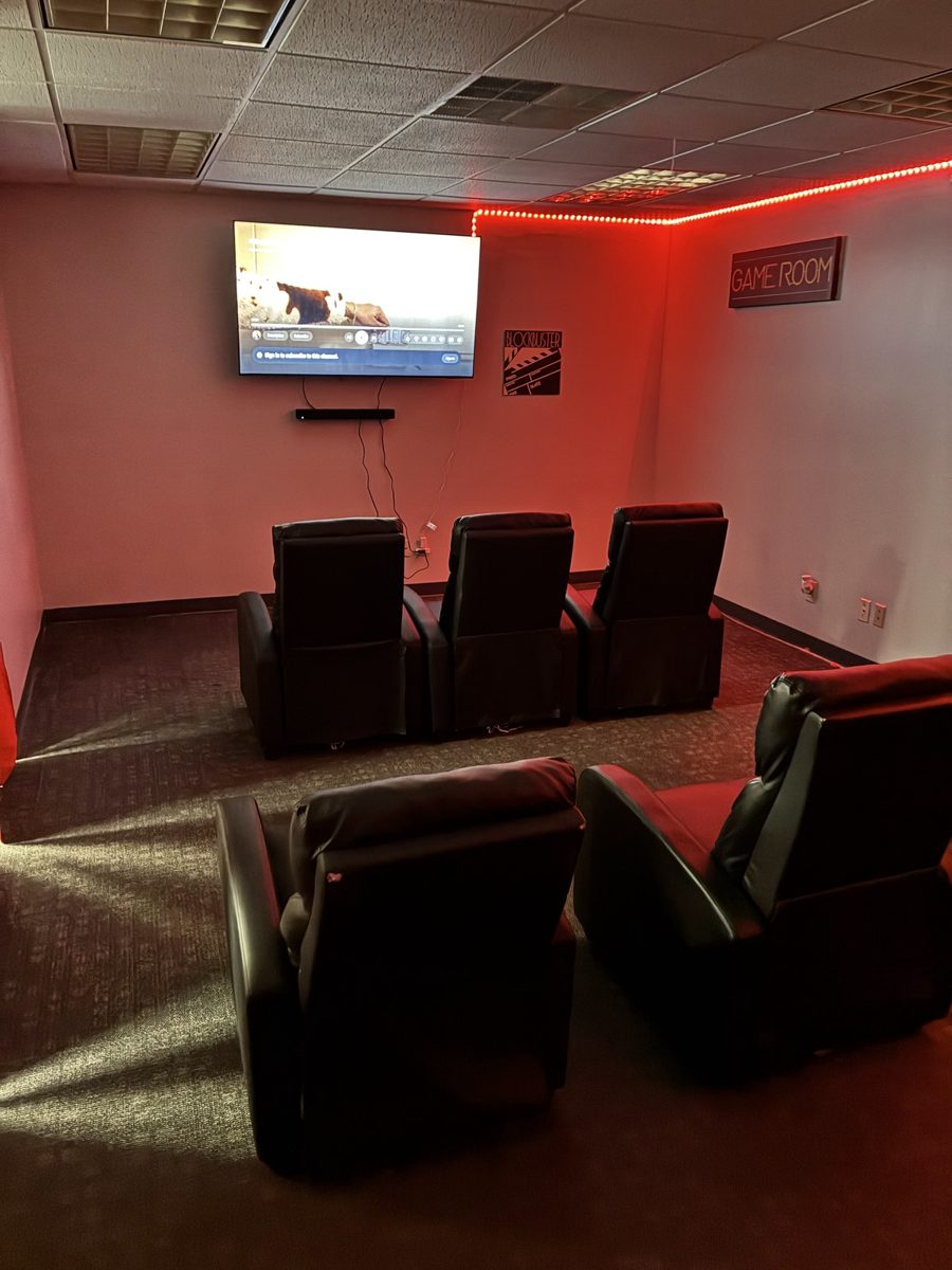 Movie lounge with recliners at the B.A.S.I.C. campus